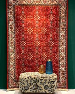 Methods of removing stains from hand-woven carpets